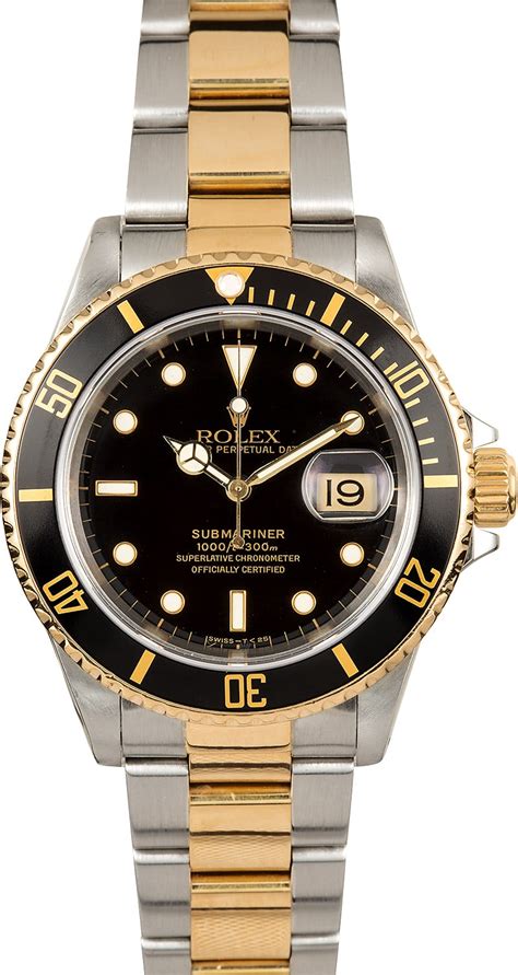 rolex black and gold submariner.